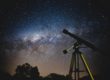 black telescope under blue and blacksky
